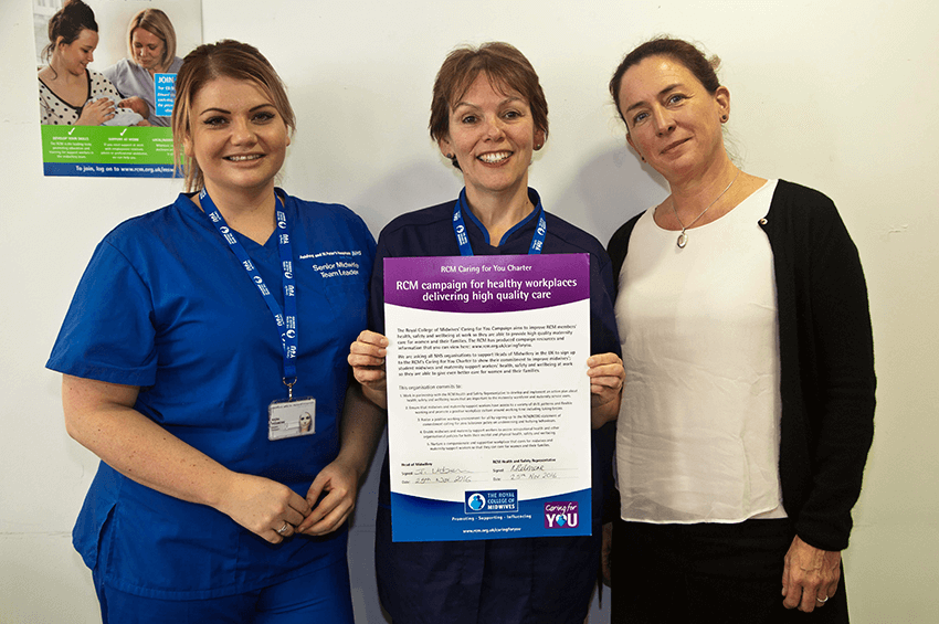 Midwife and RCM Workplace Representative Nadia Pridmore with Divisional Chief Midwife Jane Urben and RCM Representative Clare Livingstone signing the charter.